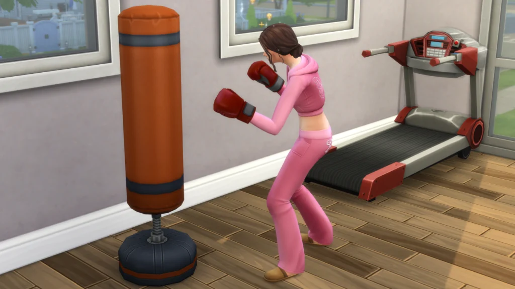 A screenshot from The Sims  4 showing a sim in a pink sweatsuit using a boxing bag