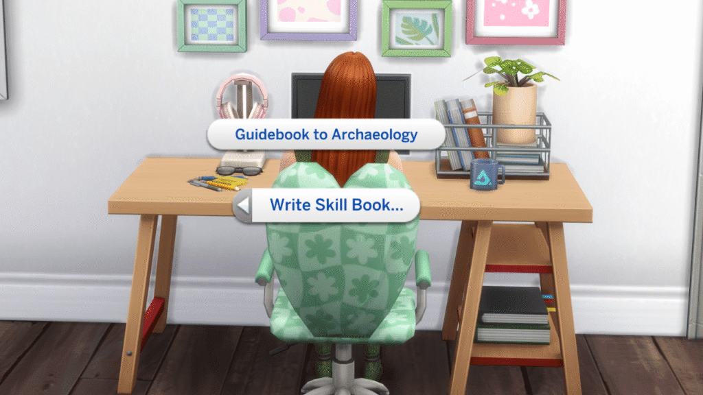 A screenshot from The Sims 4 showing a sim sitting at a desk with Write Skill Book > Guidebook to Archaeology menu options 