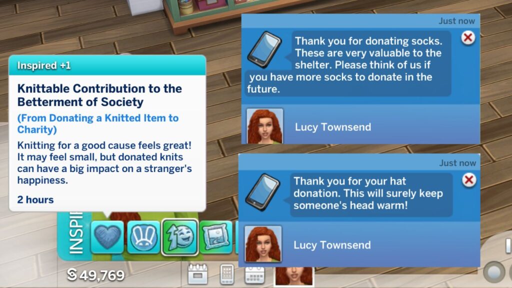 A screenshot from The Sims 4 showing the notification and moodlet you get from gifting knits