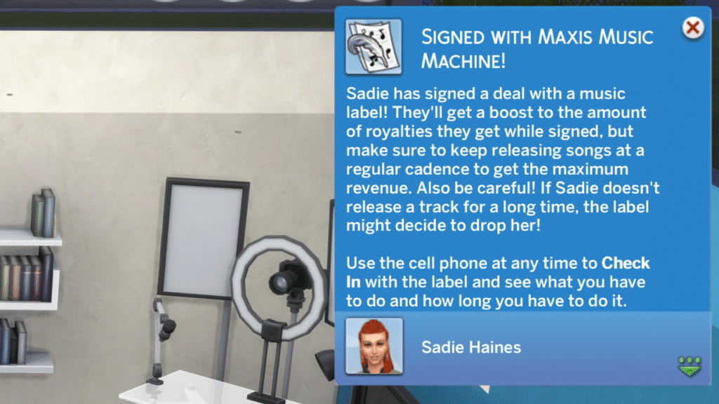 A screenshot from The Sims 4 showing the notification you get when you sign with a record label