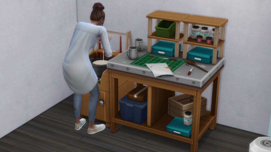 A screenshot of a sim making candles at the candle making table