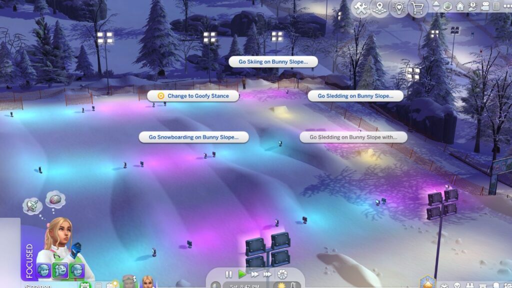 A screenshot from the sims 4 showing the options to ski on a bunny slope 