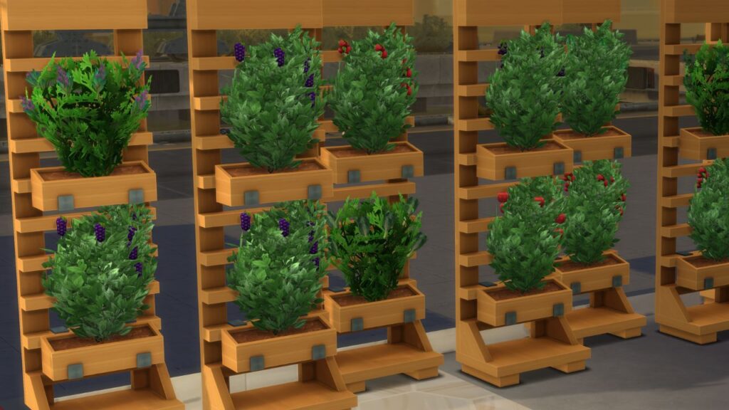 An image of a set of vertical planters with ready to harvest plants showing