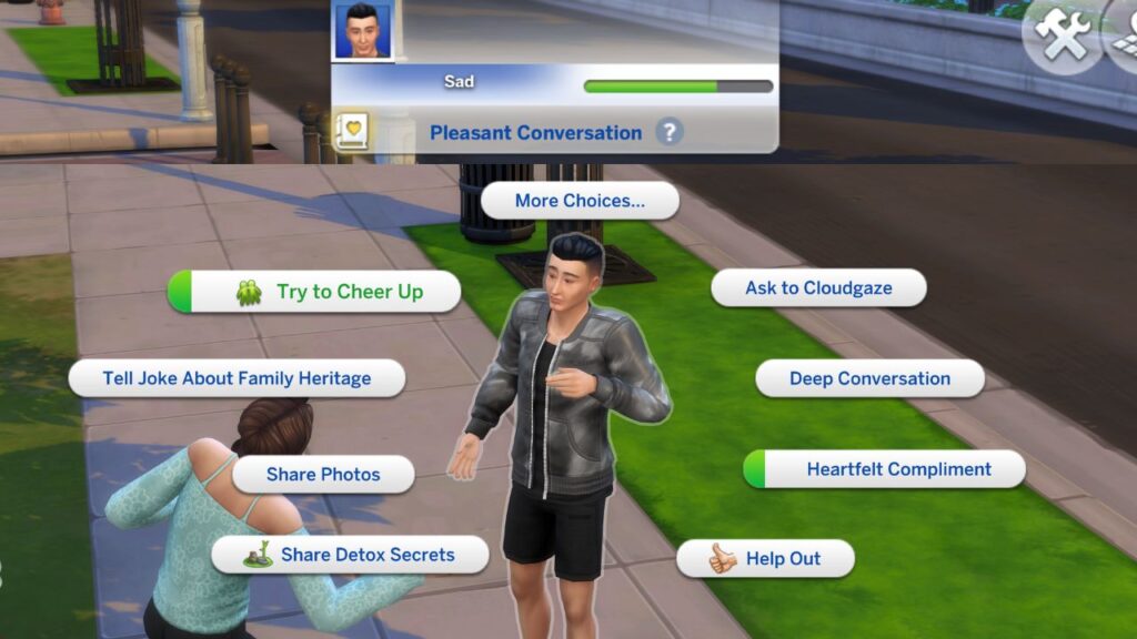 A screenshot from The Sims 4 showing the option to cheer up a sad sim