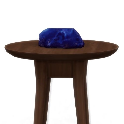 A screenshot from The Sims 4 showing a brown wooden table with blutonium on top