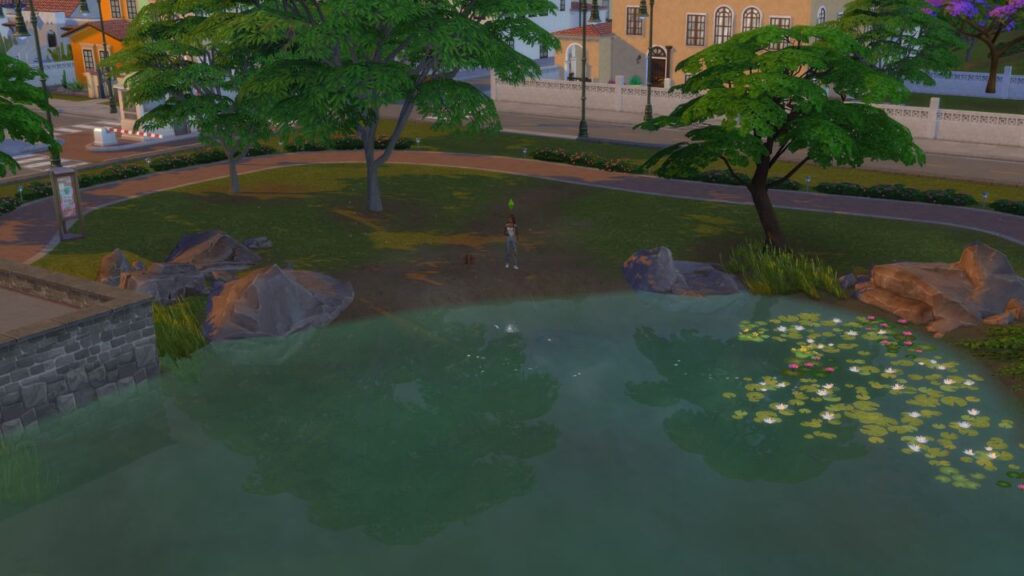 A screenshot from The Sims 4 showing  a fishing spot at a pond