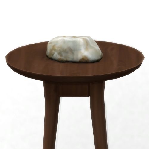 A screenshot from The Sims 4 showing a brown wooden table with ironyum on top