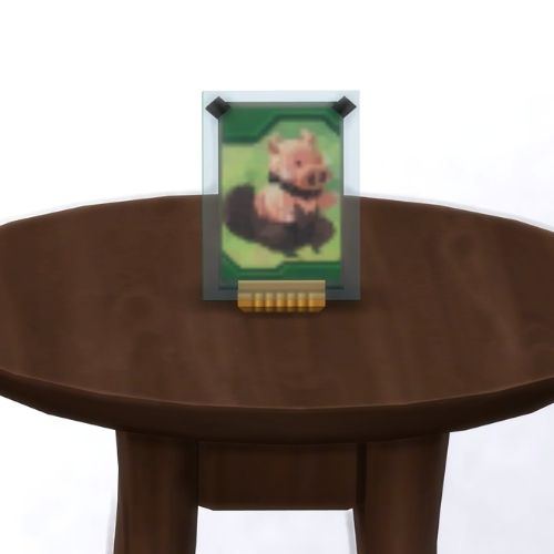 A screenshot from The Sims 4 showing a brown table with a Voidcritter on top. This has the voidcritter named sunitor