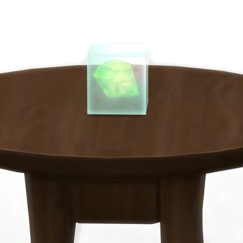 A screenshot from The Sims 4 showing a dark brown table with a Xenopetrium element in a square on top
