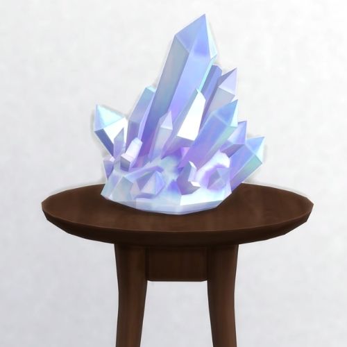 A screenshot from The Sims 4 showing a brown circular table with a crystal on top. This image has a crystal called alabaster
