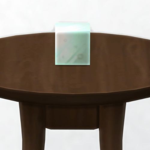 A screenshot from The Sims 4 showing a dark brown table with an alcineat in a square on top