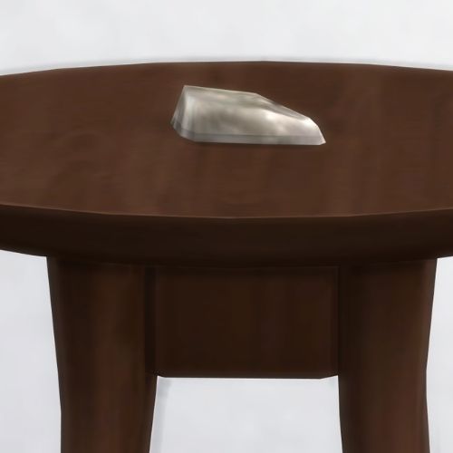 A screenshot from The Sims 4 showing a brown wooden table with Alcron on top