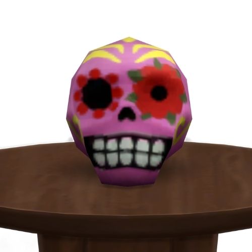 A screenshot from The Sims 4 showing a brown circle table with a pink and yellow and red skull on top