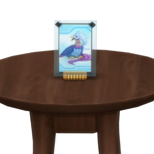 A screenshot from The Sims 4 showing a brown table with a Voidcritter on top. This has the voidcritter named avesu