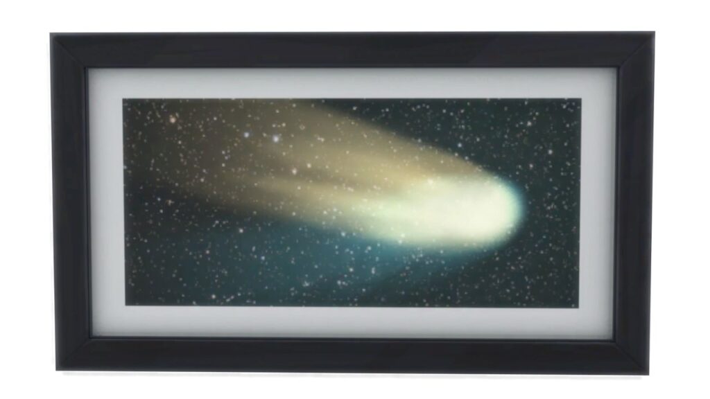 A screenshot from The Sims 4 showing a black frame with a print of a shooting star