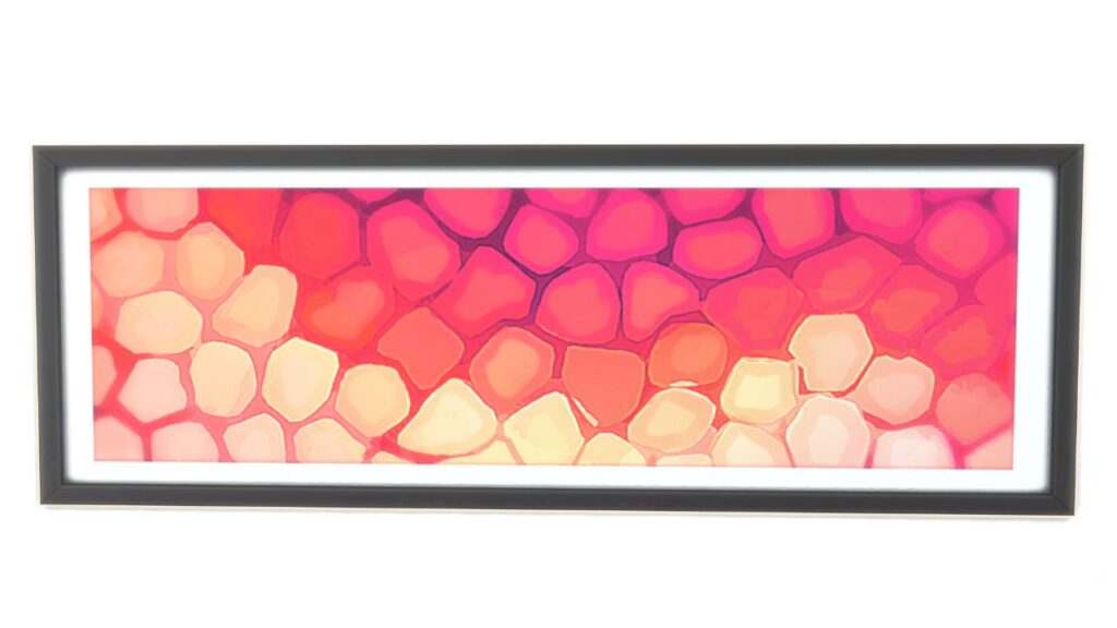 A screenshot from The Sims 4 of a black frame with an image of cells in pink under a microscope 