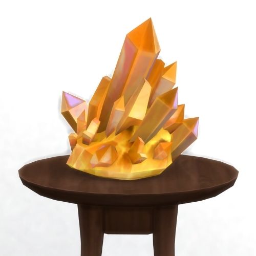 A screenshot from The Sims 4 showing a brown circular table with a crystal on top. This image has a crystal called citrine