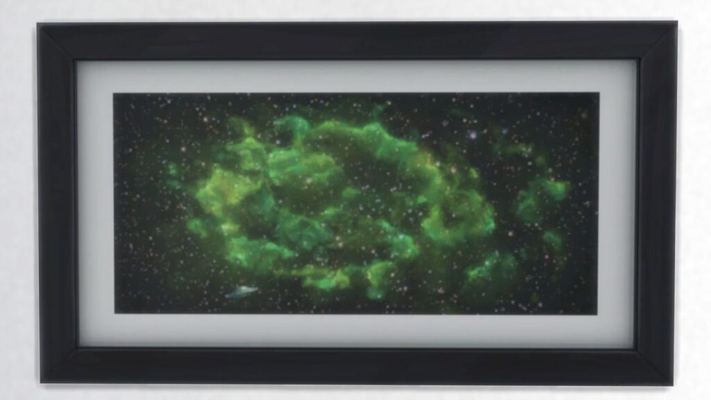 A screenshot from The Sims 4 showing a black frame with a print of a galaxy in bright green