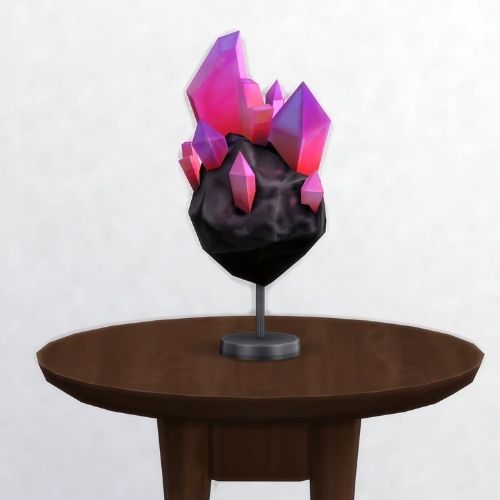 A screenshot from The Sims 4 showing a common space rock on a dark wooden table