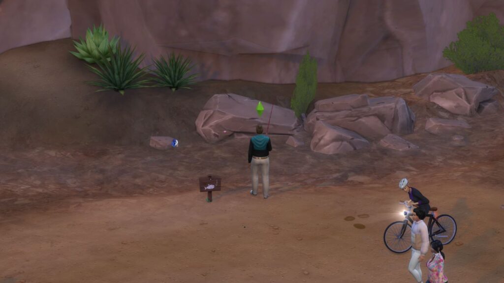 A screenshot from The Sims 4 showing the location of a fishing spot in Desert Bloom Park at the entrance
