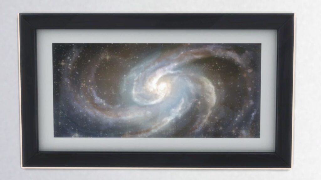A screenshot from The Sims 4 showing a black frame with a print of a galaxy inside