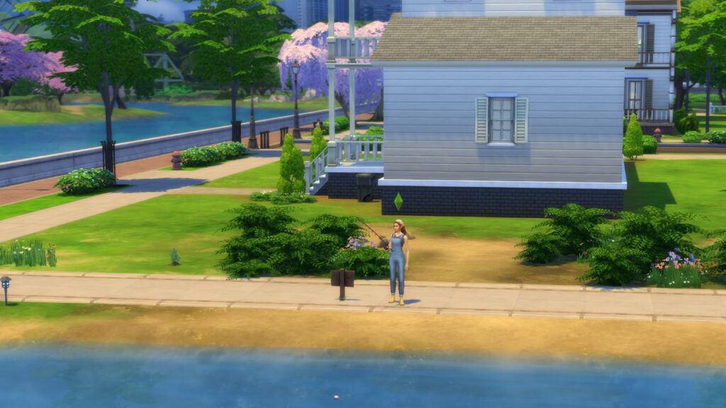 A screenshot from The Sims 4 showing a fishing spot next to the riverside roost lot
