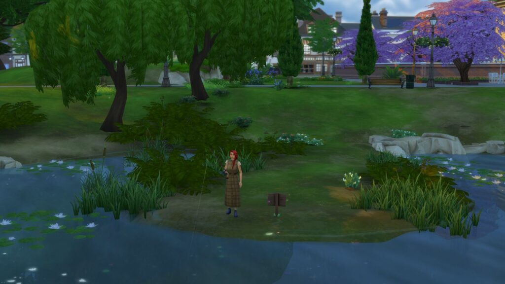 A screenshot from The Sims 4 showing a fishing spot on a small peninsula with a sim fishing there
