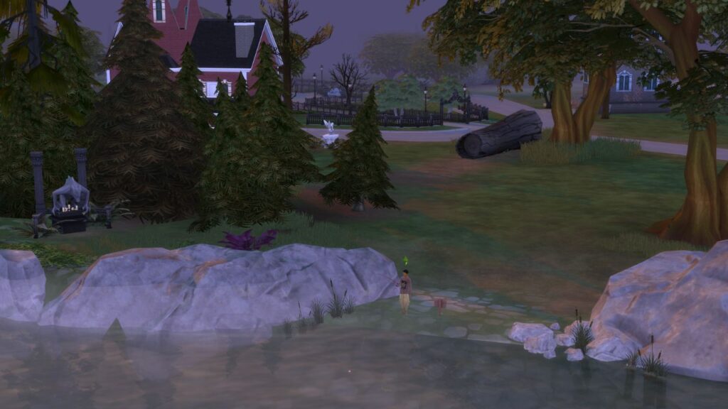 A screenshot from The Sims 4 showing a fishing spot that's located beside a lot and a path way in Forgotten Hollow
