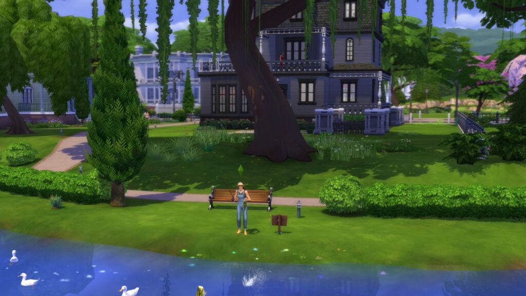 A screenshot from The Sims 4 showing a fishing spot behind the Goth household