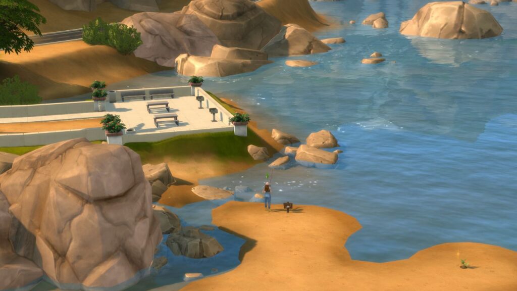 A screenshot from The Sims 4 showing a fishing spot in front of the movers & Shakers gym near a platform with grills and tables