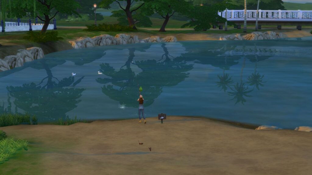 A screenshot from The Sims 4 showing a fishing spot across from the Oakenstead lot