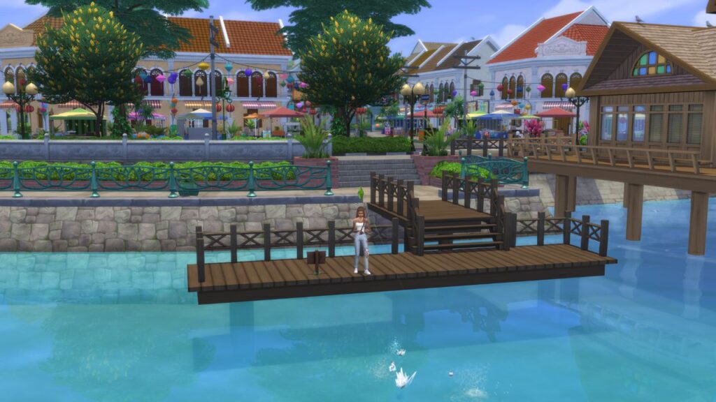 A screenshot from The Sims 4 showing a sim fishing on a dock in front of markets