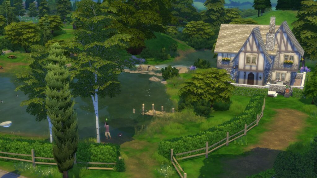 A screenshot from The Sims 4 showing a fishing spot in Windenburg located close to the free spirits household in a pond