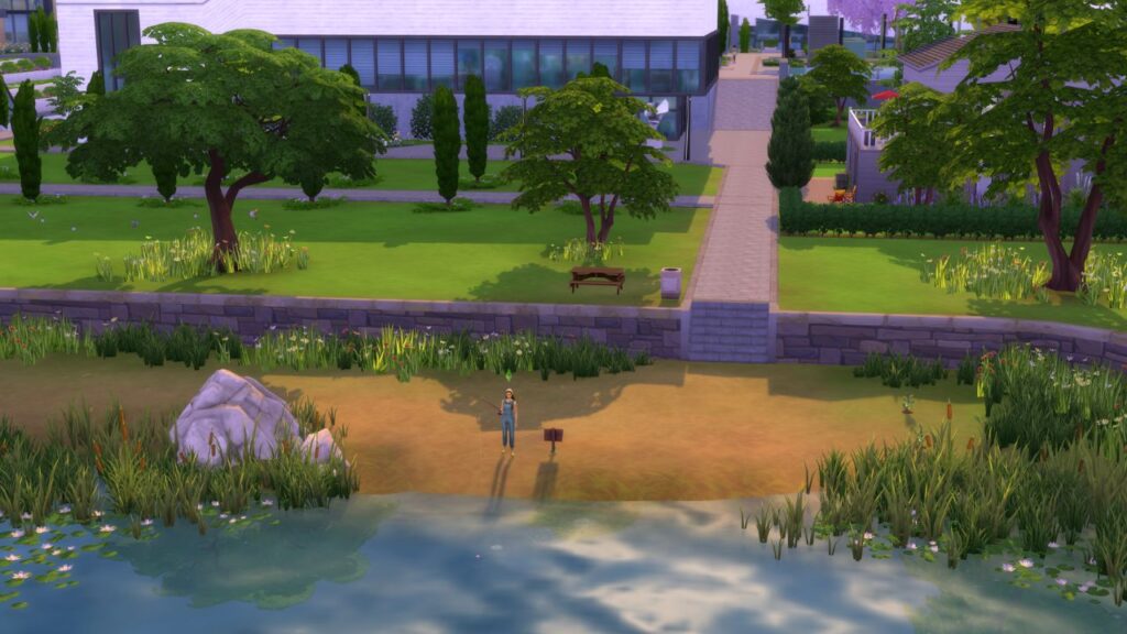 A screenshot from The Sims 4 showing a sim fishing at a fishing spot behind the guest lecture building at Foxbury institute