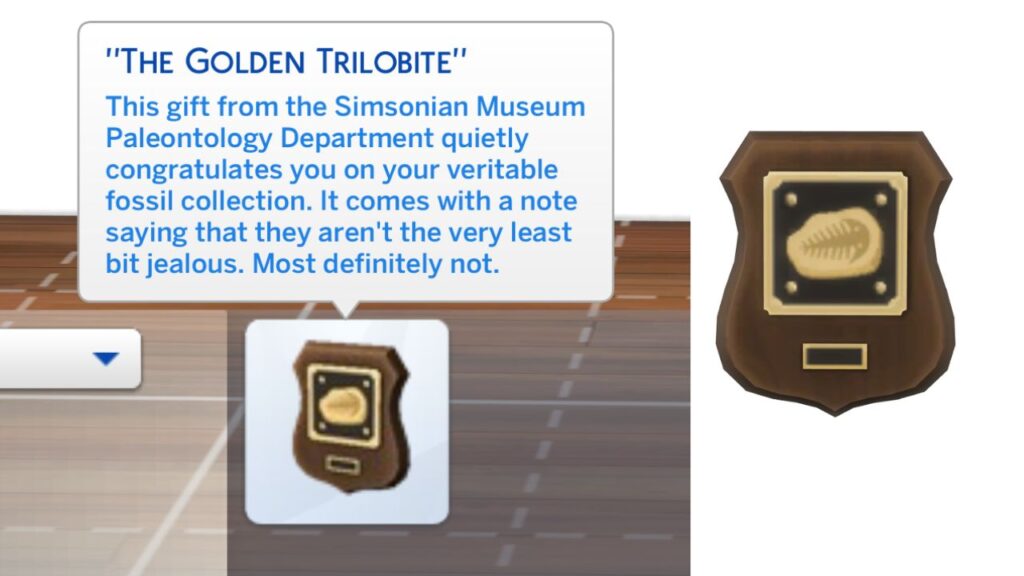 A screenshot from The Sims 4 showing the golden trilobite plaque from finishing the fossils collection