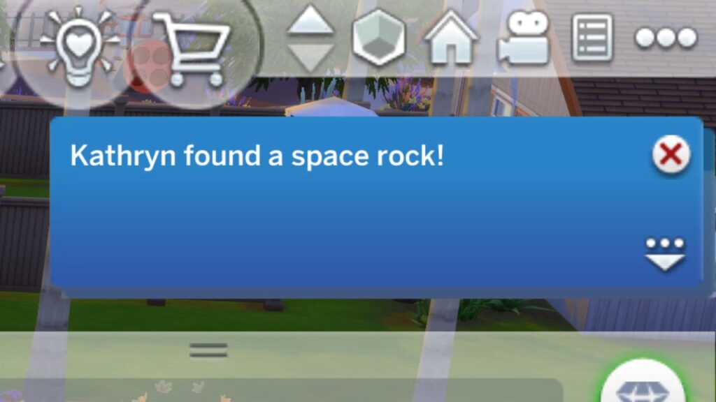 A screenshot from The Sims 4 showing a notification that says "Kathryn found a space rock!"