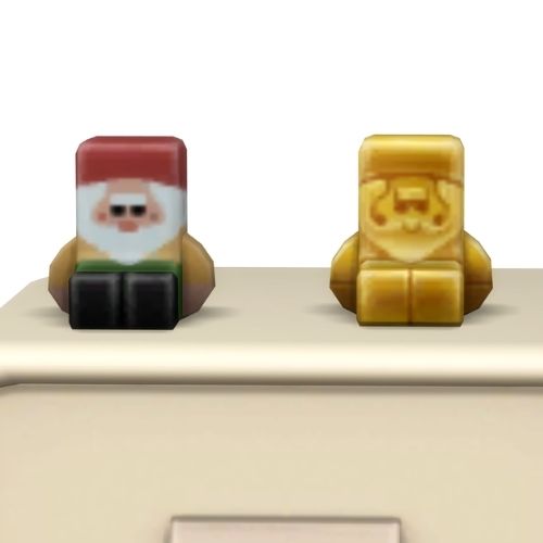 A screenshot from the sims 4 the top of a table with two Simmies on top. The one is gold and the other is a regular Gnome Simmi