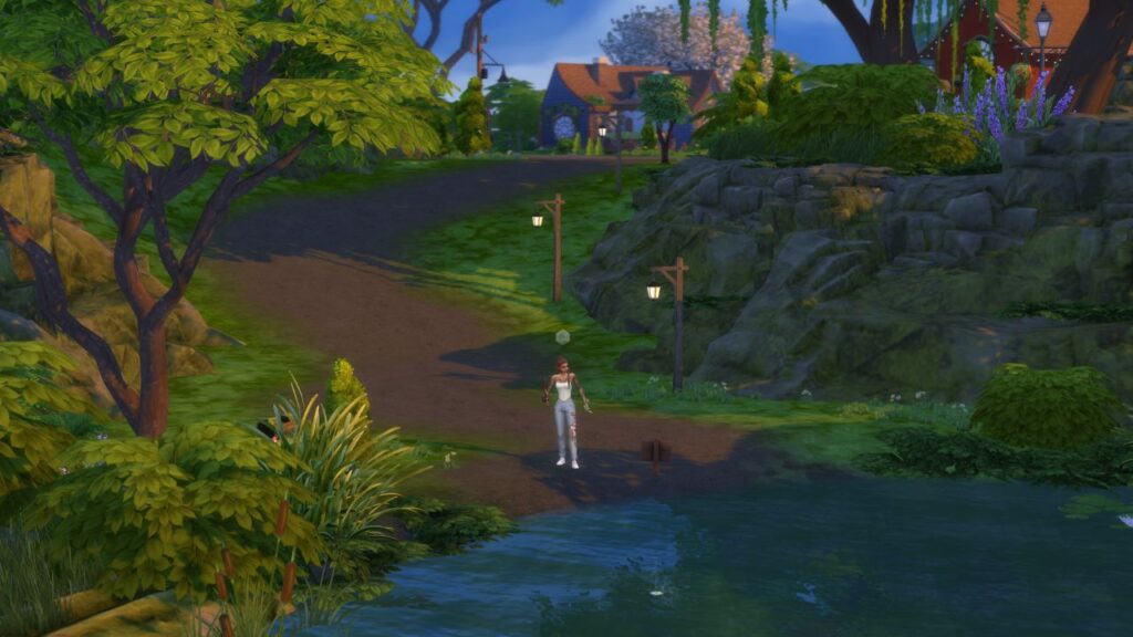 A screenshot from The Sims 4 showing a sim fishing at a river between a tree and rocks