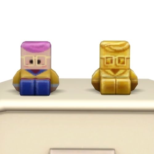 A screenshot from the sims 4 the top of a table with two Simmies on top. The one is gold and the other is a regular Izzy Fabulous Simmi