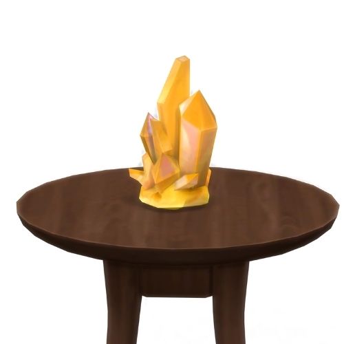 A screenshot from The Sims 4 showing a brown circular table with a crystal on top. This image has a crystal called jonquilyst