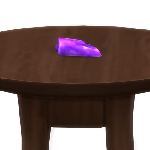 A screenshot from The Sims 4 showing a brown wooden table with literalite on top