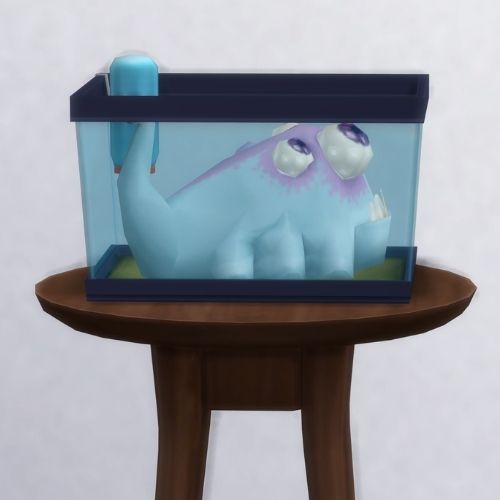 A screenshot from The Sims 4 showing a brown circle table with a terrarium on top with a pink whale alien inside