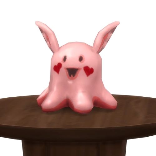 A screenshot from The Sims 4 showing a round, brown table with a Meduso Plushie on top that's pink with hearts on the face