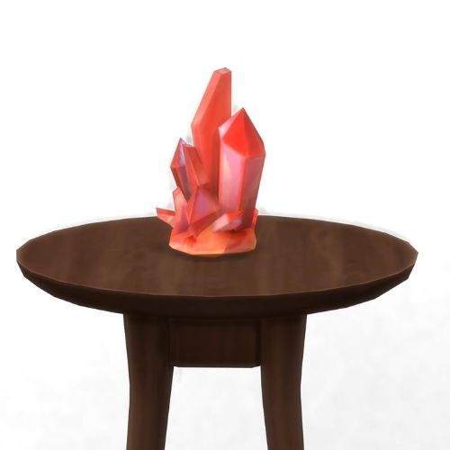 A screenshot from The Sims 4 showing a brown circular table with a crystal on top. This image has a crystal called peach