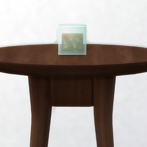 A screenshot from The Sims 4 showing a dark brown table with a Phozone in a square on top