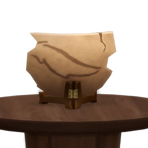 A screenshot from The Sims 4 showing a brown wood table and on top is a shard from an old pot
