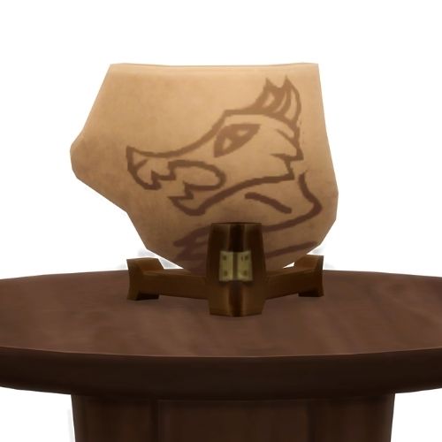 A screenshot from The Sims 4 showing a brown wood table and on top is a shard of a ceramic pot with a werewolf painted on it