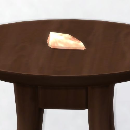 A screenshot from The Sims 4 showing a brown wooden table with rose gold on top