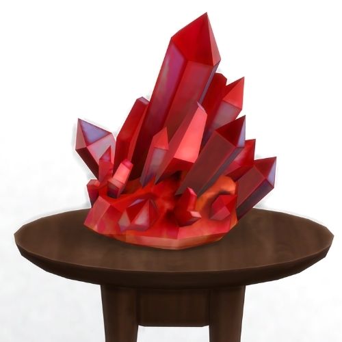 A screenshot from The Sims 4 showing a brown circular table with a crystal on top. This image has a crystal called ruby