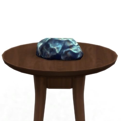 A screenshot from The Sims 4 showing a brown wooden table with sadnum on top